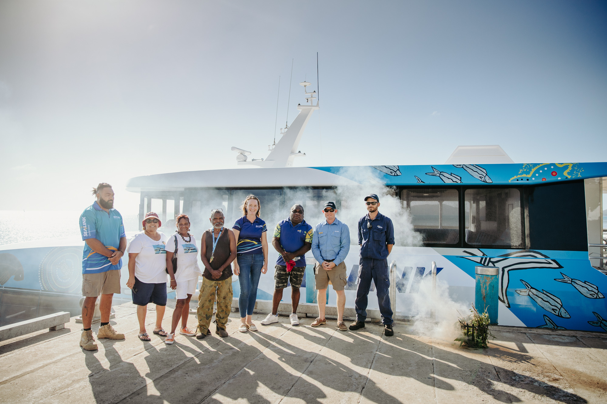 SeaLink crew with Palm Island residents welcome Coolgaree Cat with a smoking ceremony SeaLink crew with Palm Island residents welcome Coolgaree Cat with a smoking ceremony